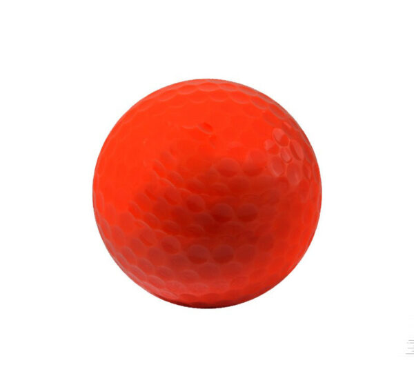 Red golf ball with power and beauty